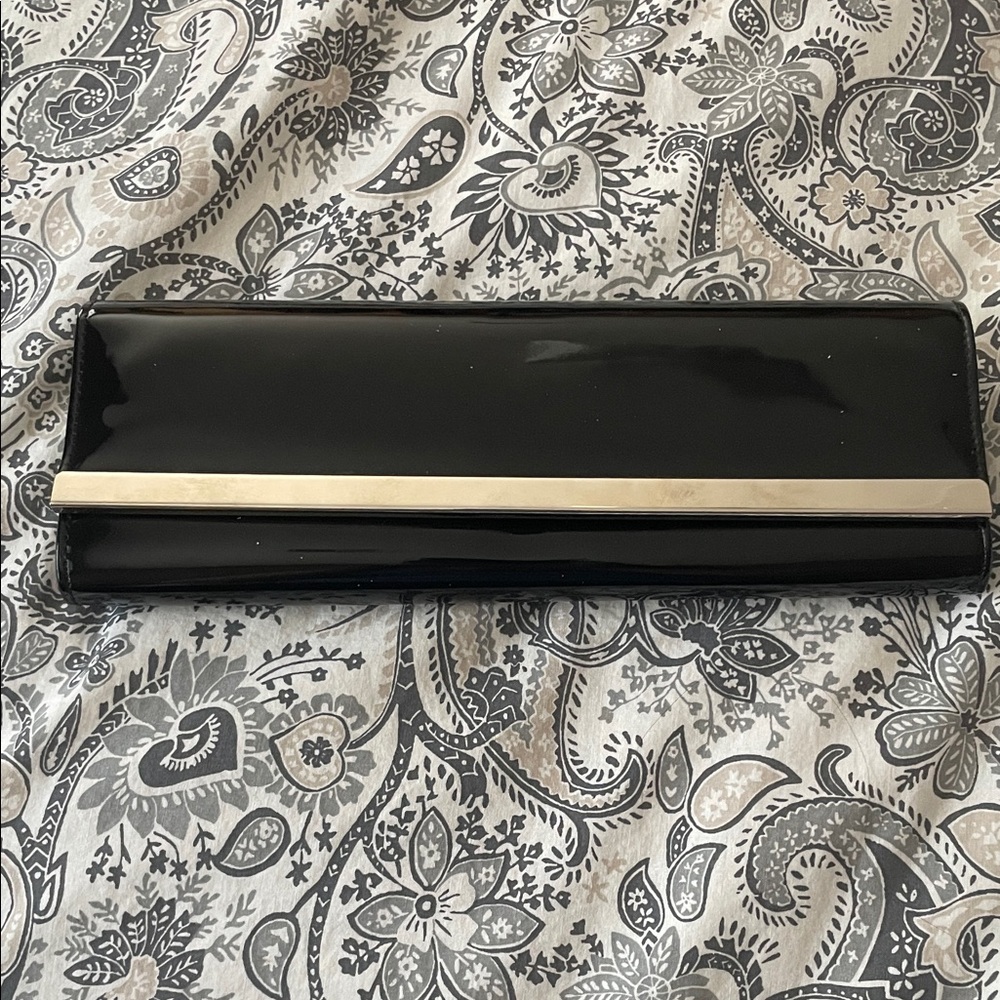 Black clutch evening bag. Can be used as a clutch or with strap.